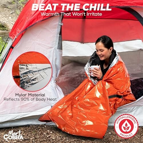 Woman wrapped in an orange Mylar blanket sitting in a tent.