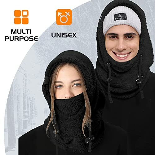 Two people wearing black winter face covers, one with a beanie, both smiling.