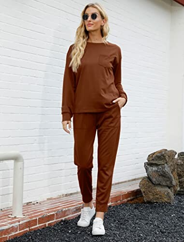 Woman wearing a brown loungewear set and white sneakers