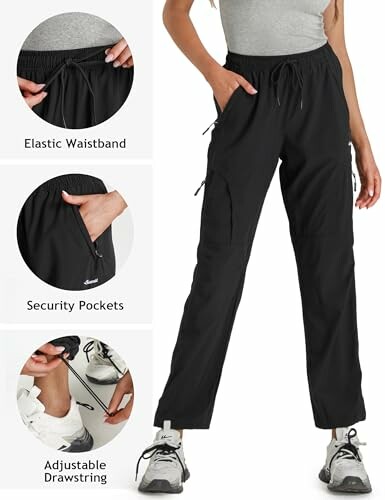 Woman wearing black athletic pants with elastic waistband, security pockets, and adjustable drawstring.