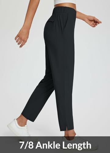 Woman wearing black 7/8 ankle length pants